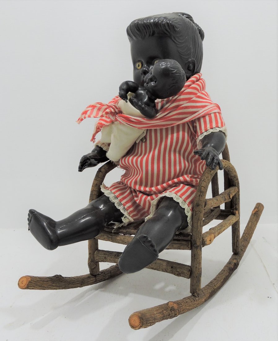 Black Americana plastic mother & child doll: in twig rocker, 11"