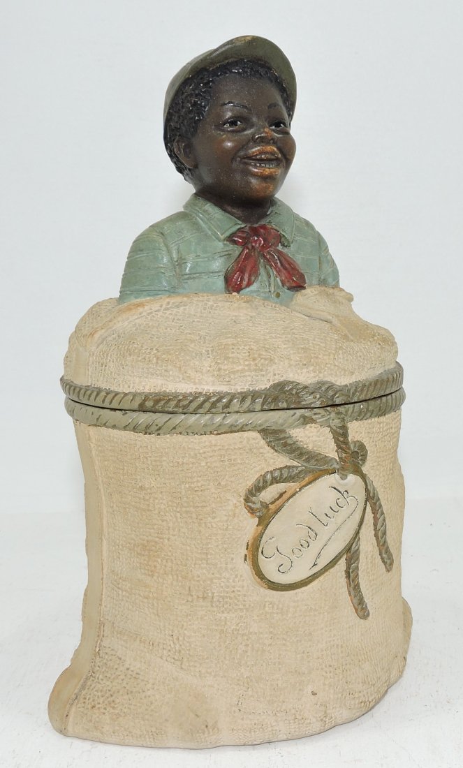 Black Americana terra cotta humidor of jockey: in sack, 8", signed J.M.
