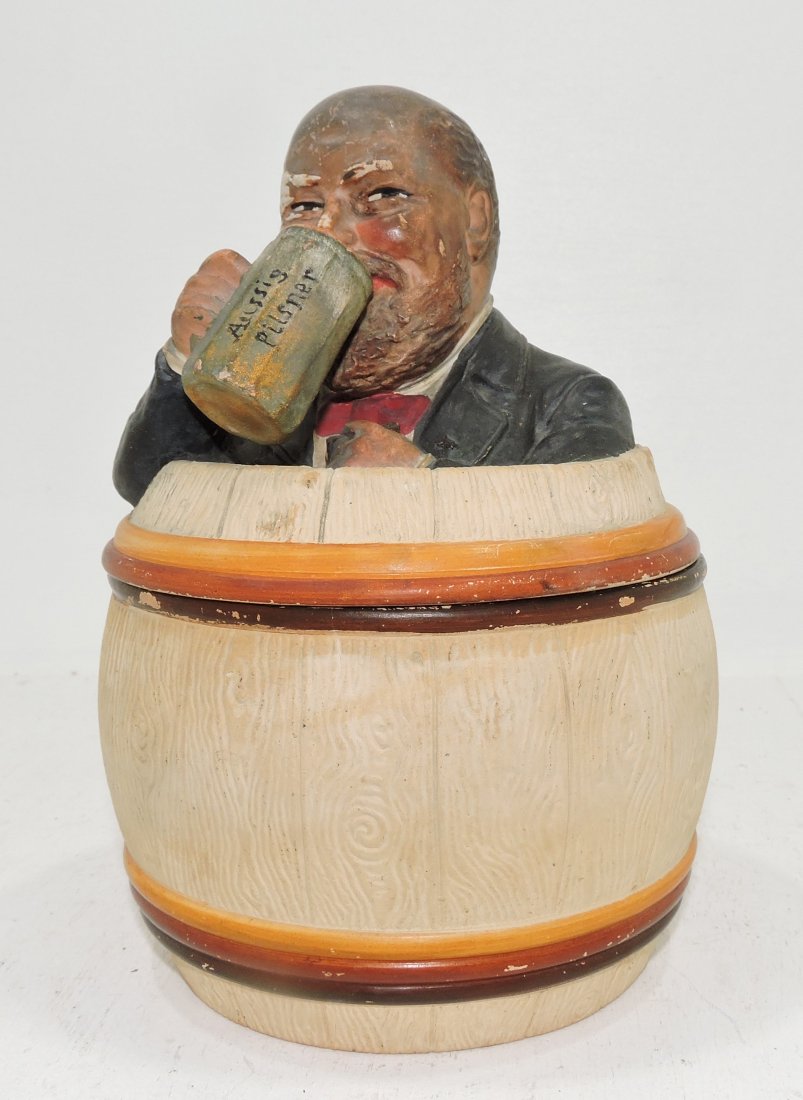 Black Americana terra cotta humidor of man in: barrel, 7 1/2", signed J.M.