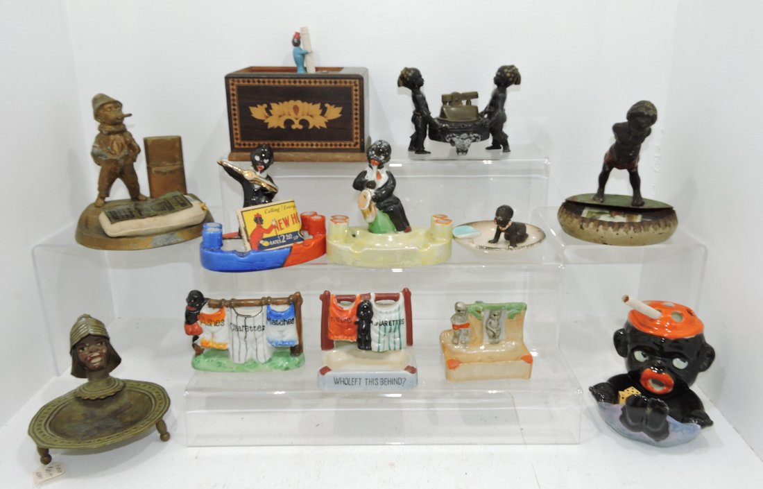 Black Americana lot of 12 figural: ashtrays, cigarette dispenser, and lighter