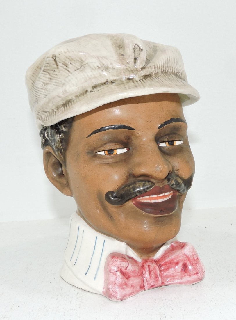 Black Americana majolica humidor: of a man with cap and bowtie, 7"