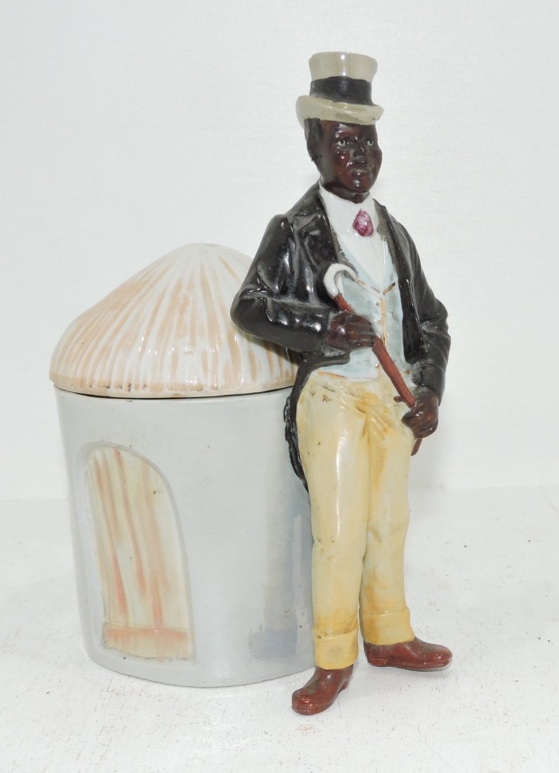 Black Americana porcelain humidor: of man with cane, 7"