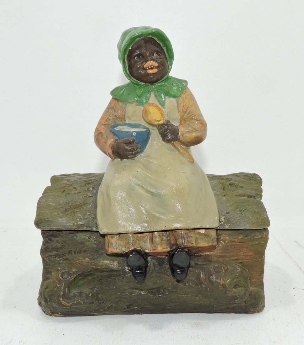 Black Americana terra cotta humidor: of lady atop log, professional repair to lid, 8 1/2"