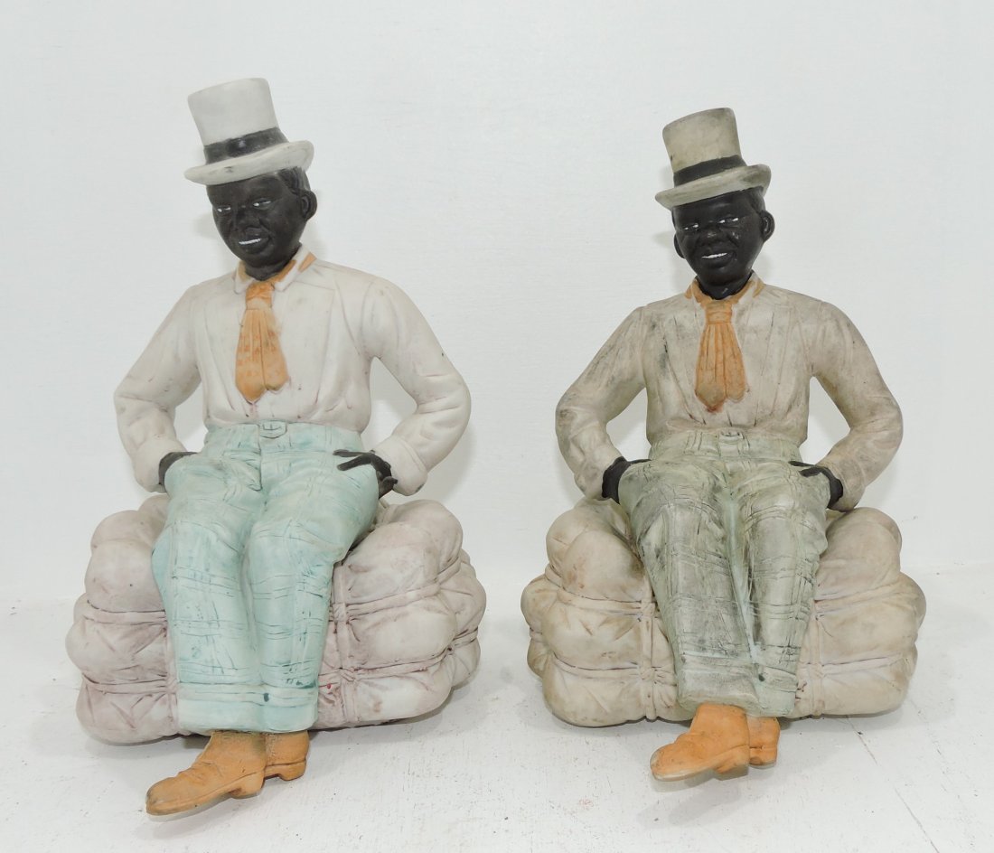 Black Americana pair of bisque figures: of men atop bundle of cotton, 9 1/2"