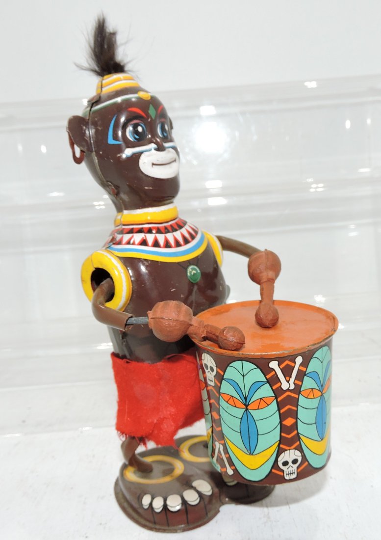 Black Americana Native with drum tin: litho wind up toy, loss of one drumstick, works