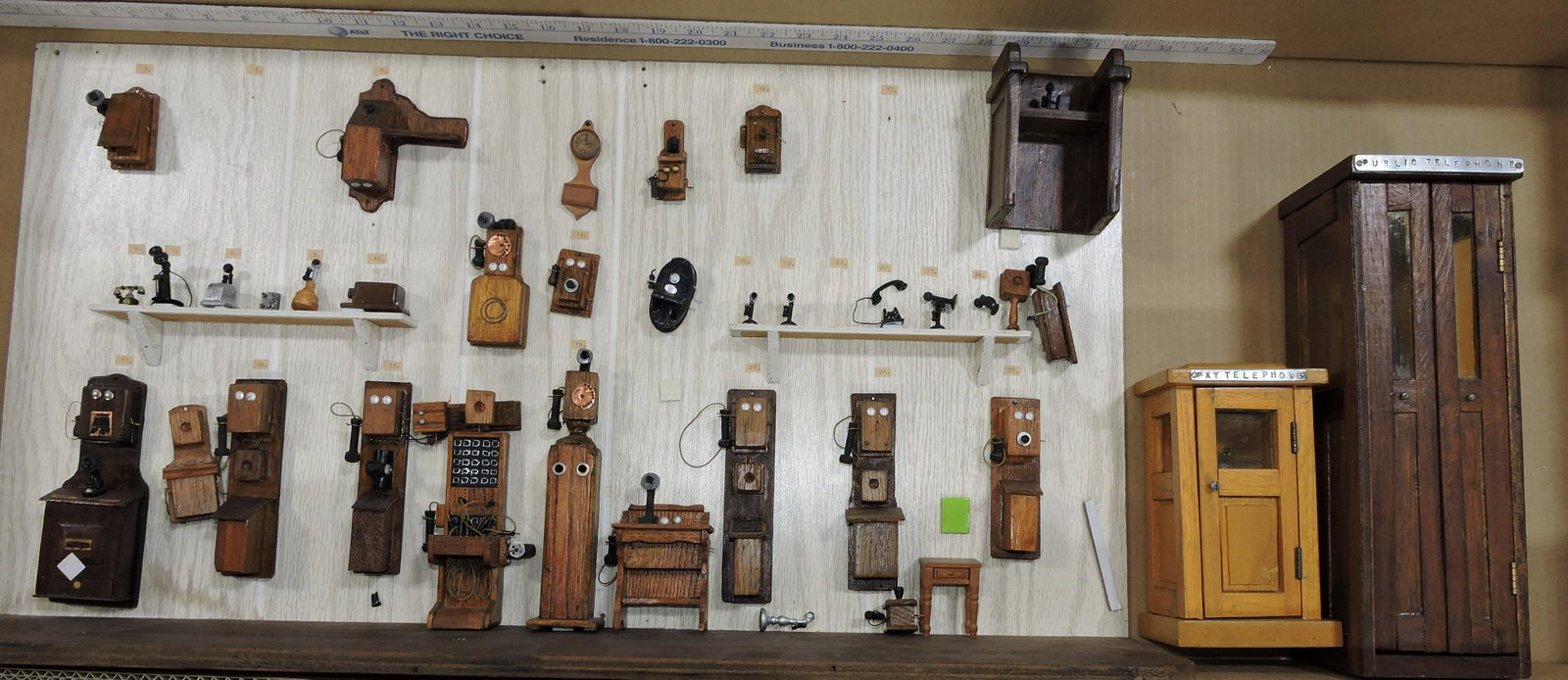 Diorama of collection of antique: telephones and telephone booths