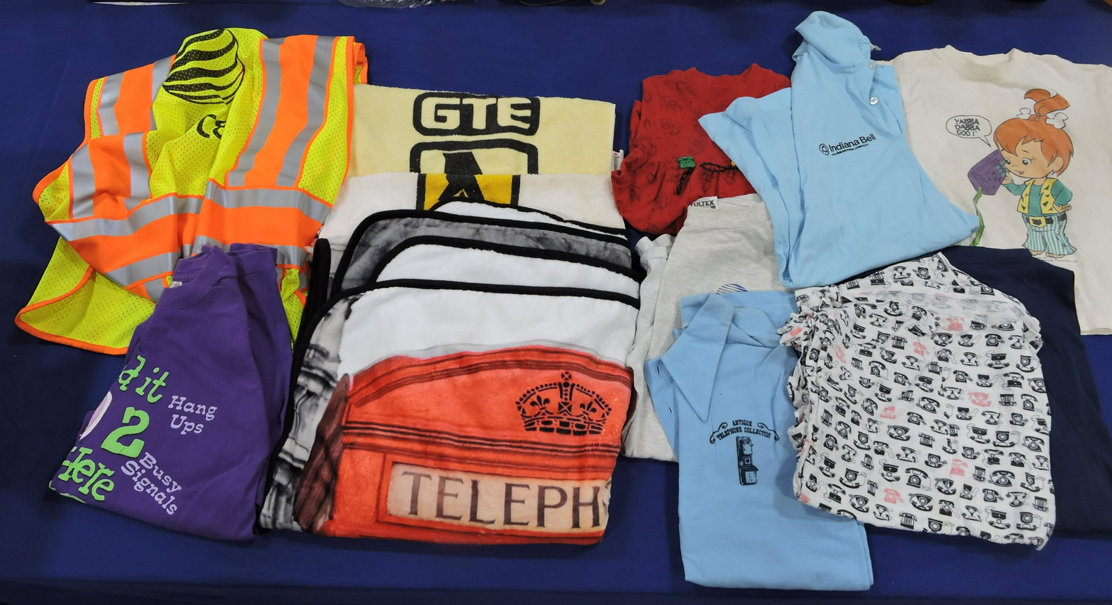 Lot of telephone related towels, T-shirts,: AT&T vest, and other linens and 10 baseball hats