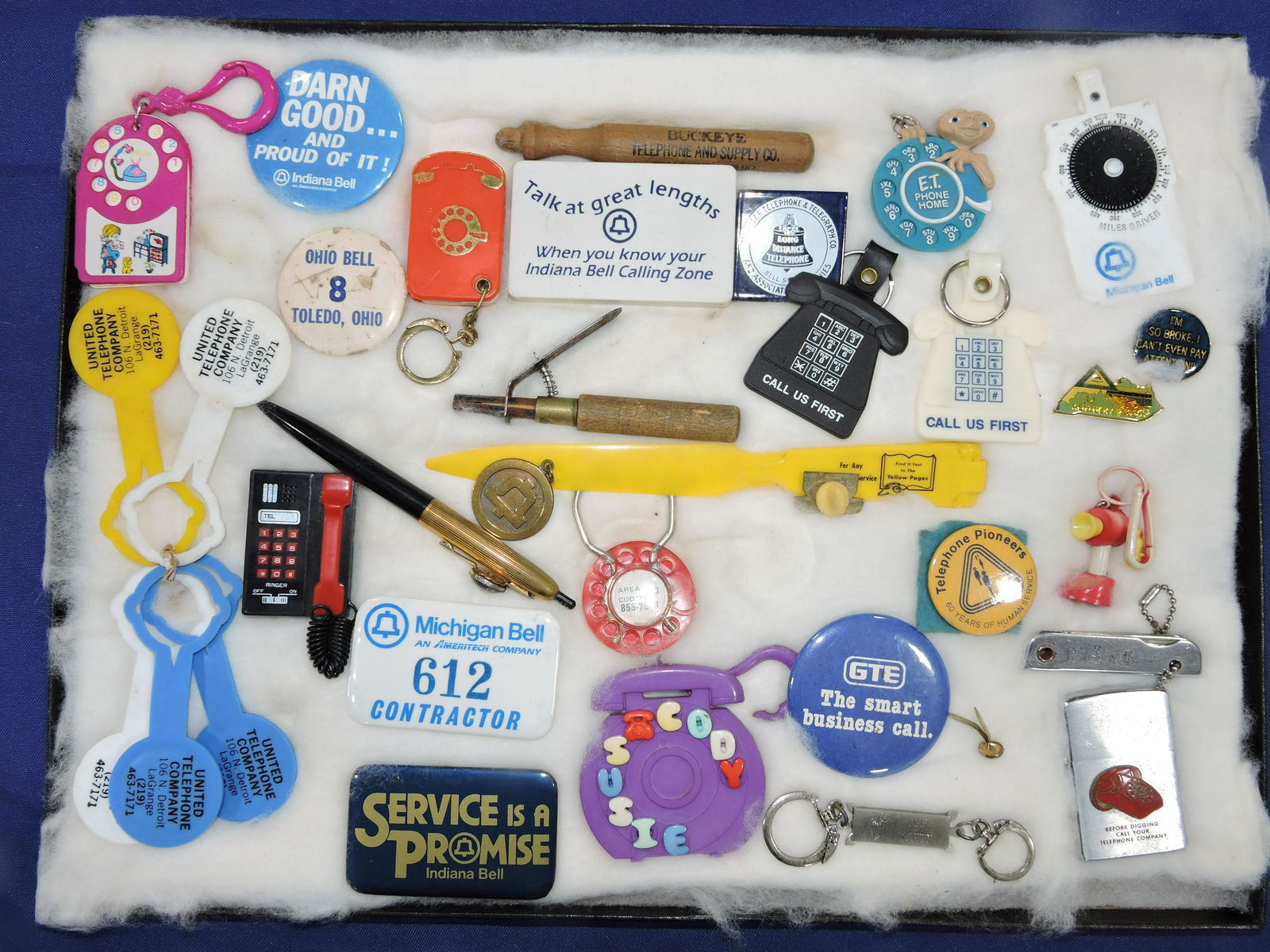 Lot of telephone related keychains,: lighter, pens, and other premiums