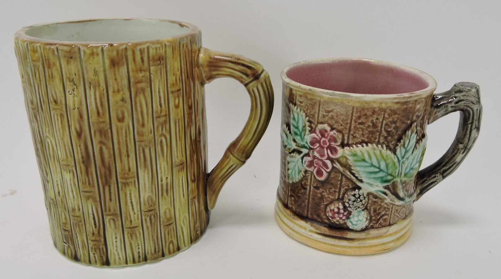 Majolica lot of 2 mugs, bamboo and: blackberry, each with frogs inside; minor rim repair to bamboo