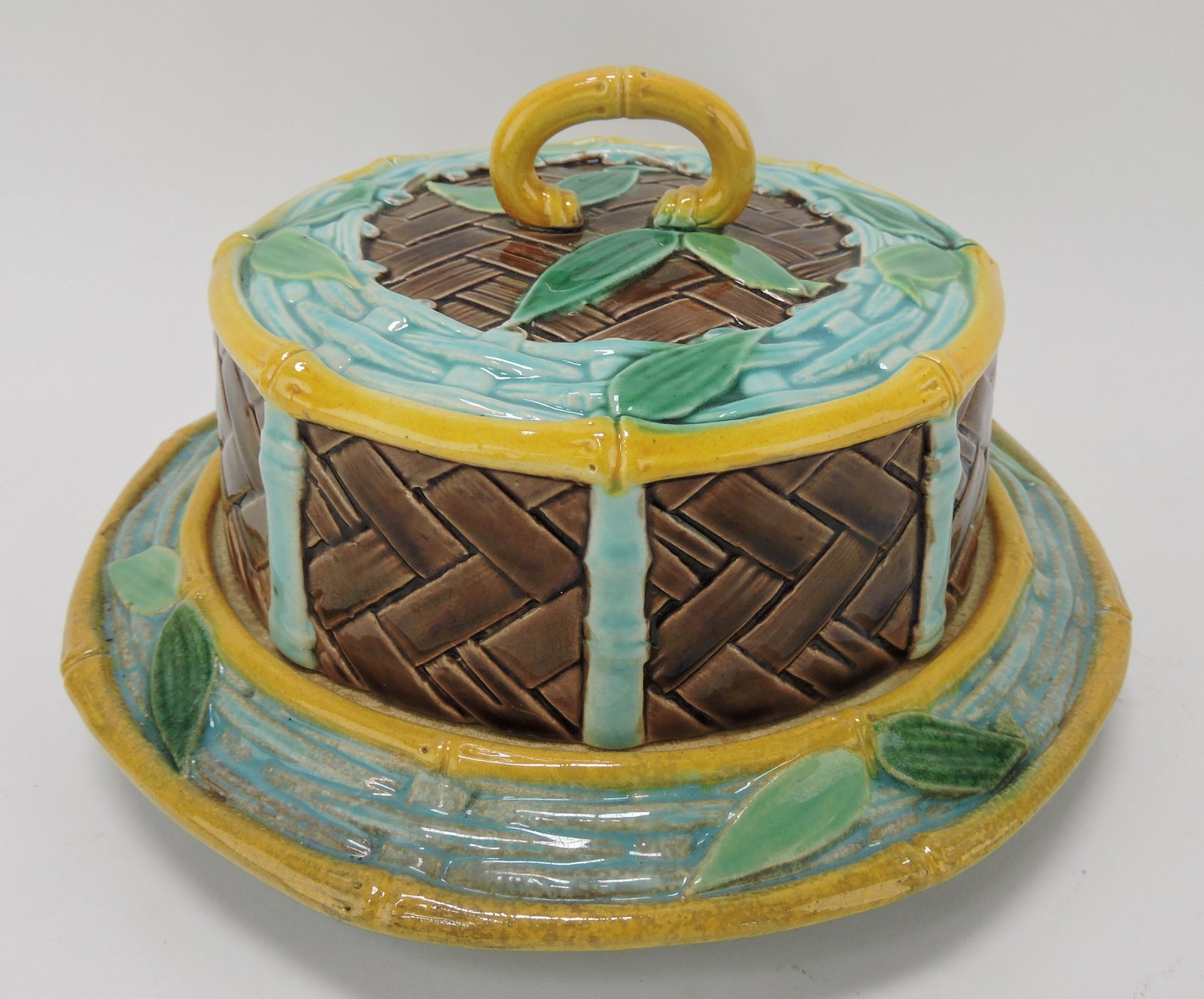 Victoria Pottery Co (VPC) majolica: wicker butter dish, some staining