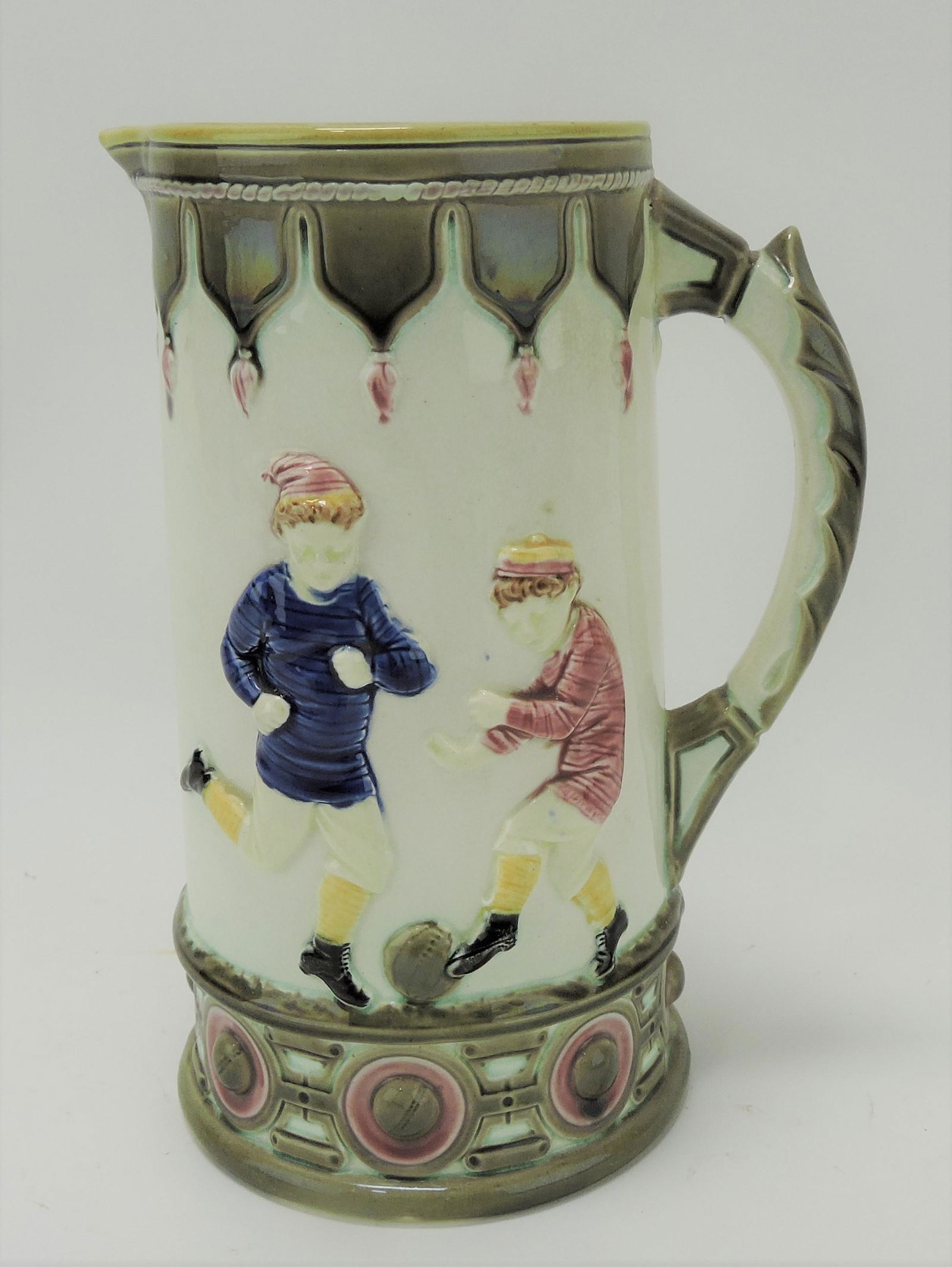 Wedgwood majolica soccer and cricket: sporting jug, 8", nick to rim