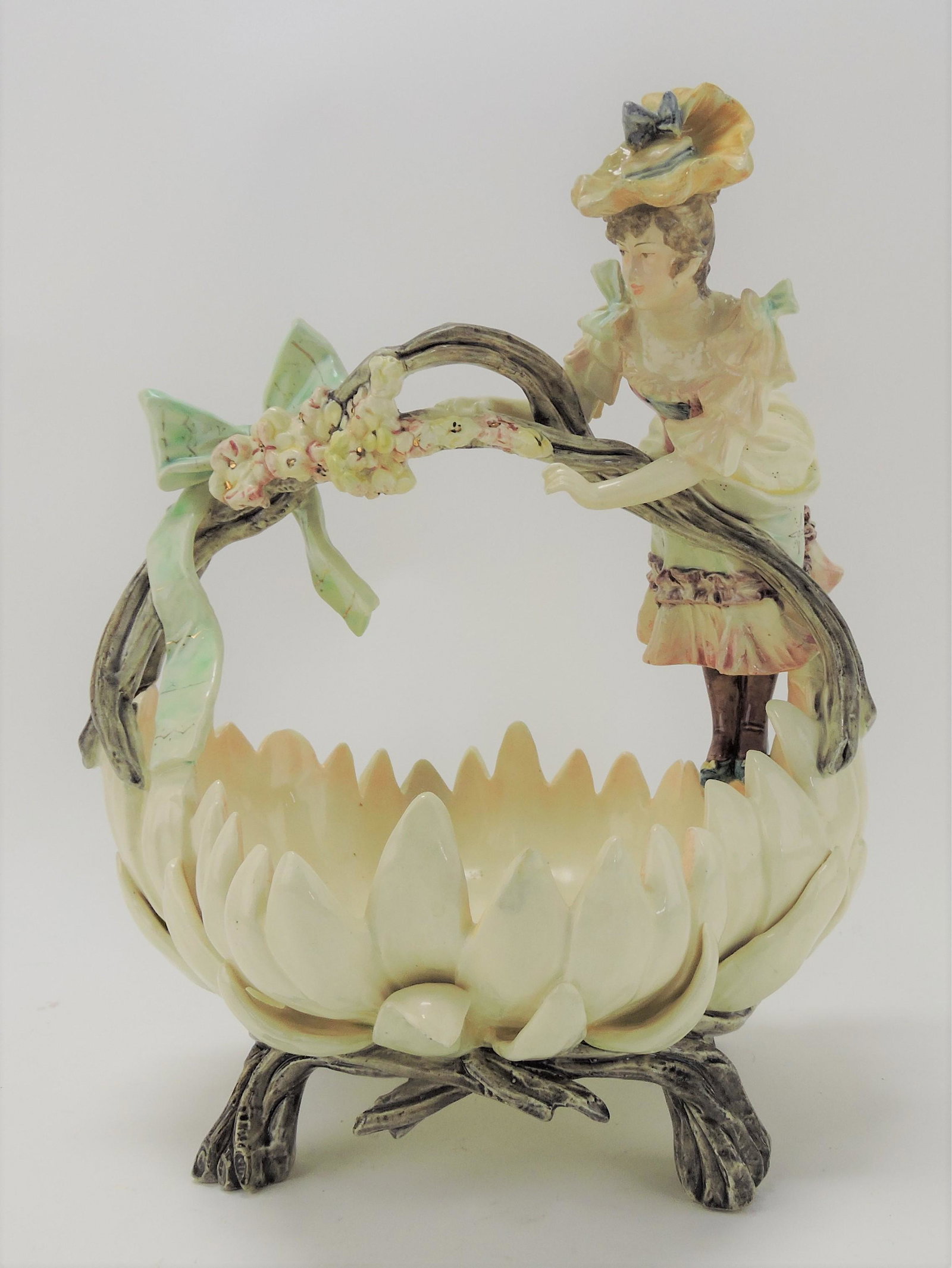 Majolica lady on handle of basket table: center, 13"h, 10"w, some repairs and losses