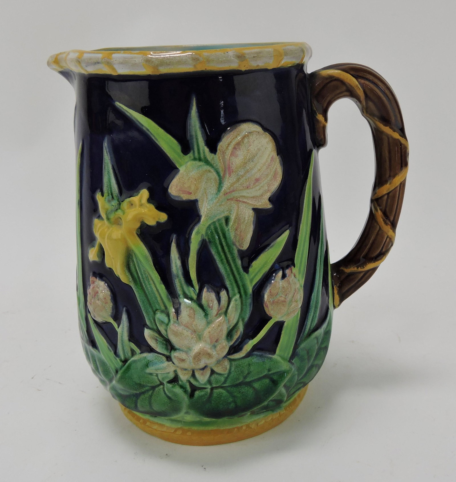 George Jones majolica cobalt water: lily and iris pitcher, 6 1/2"