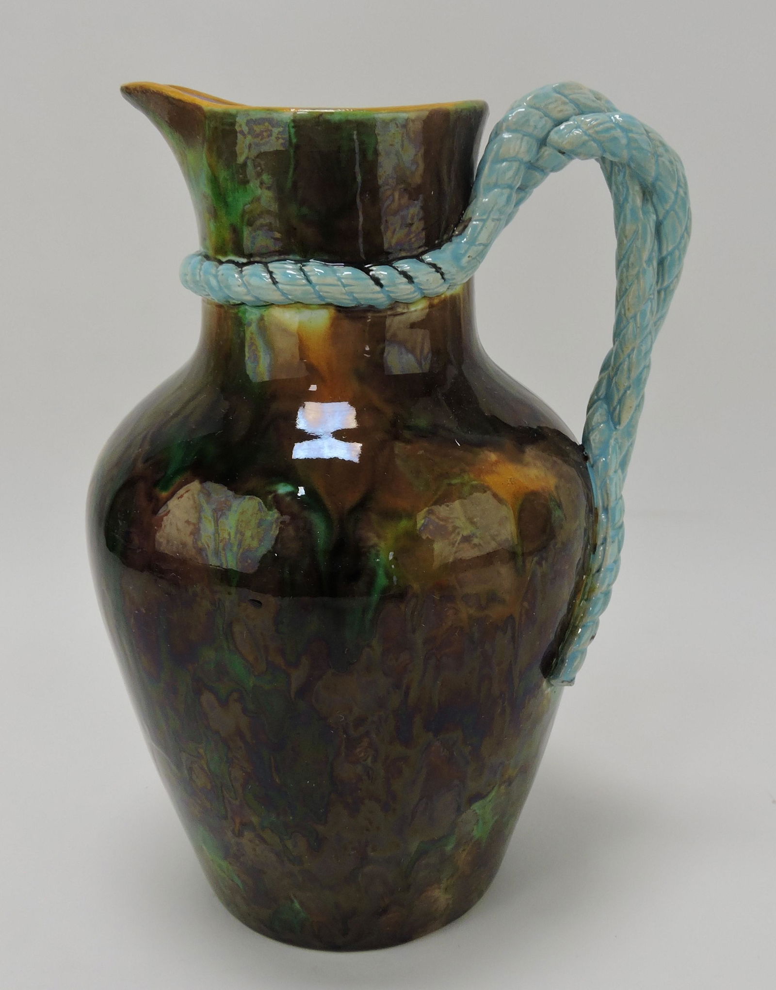 George Jones majolica mottled pitcher: with turquoise rope handle, 10", professional spout repair