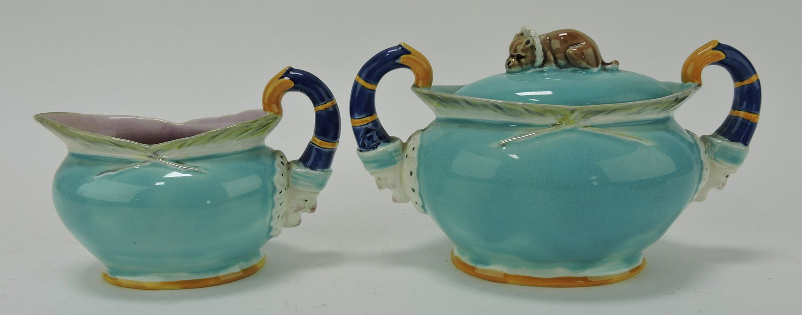 Wedgwood majolica Punch & Judy: cream & sugar, minor rim nick to lid