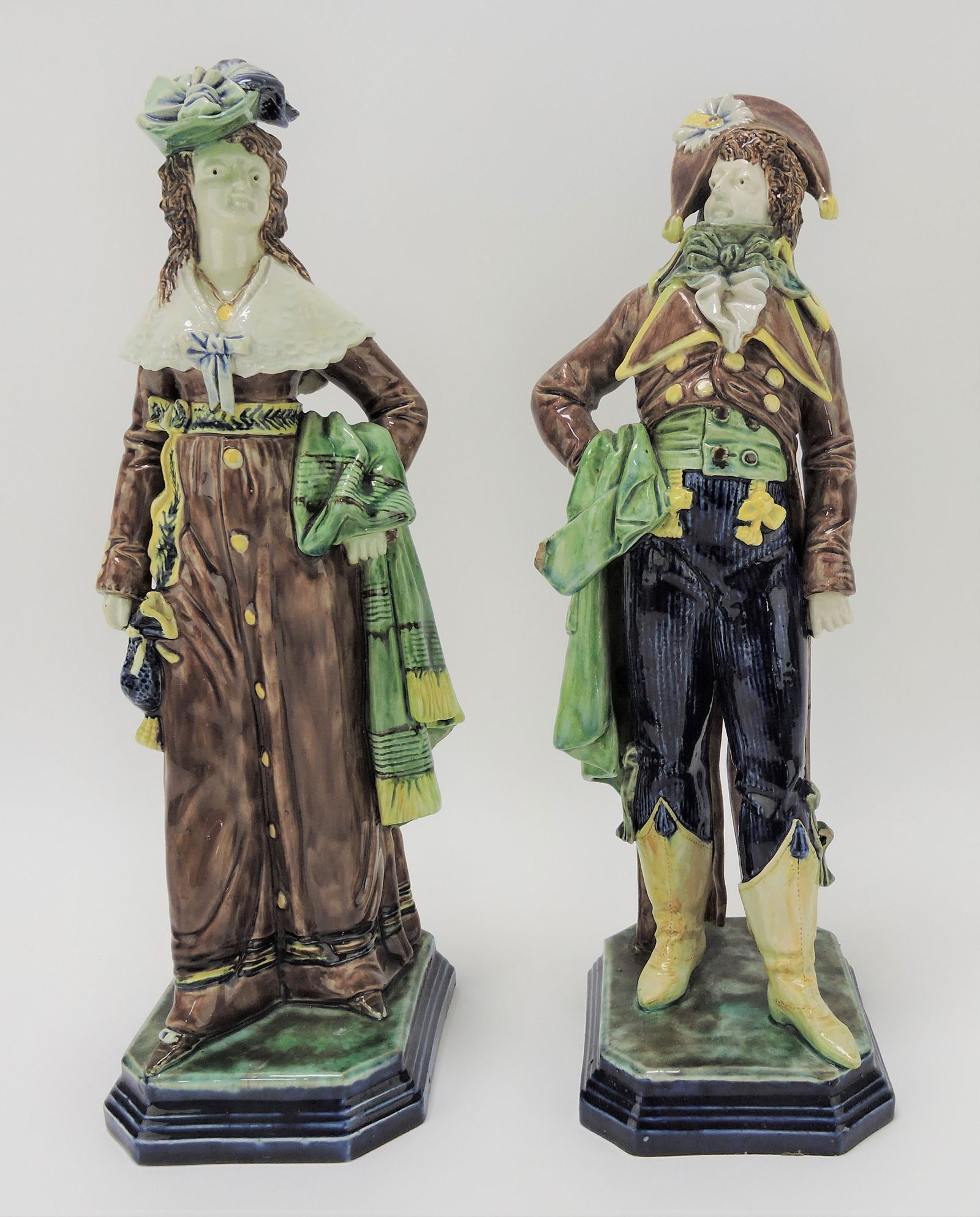 Hugo Lonitz majolica pair of figures: of man and woman, 13"