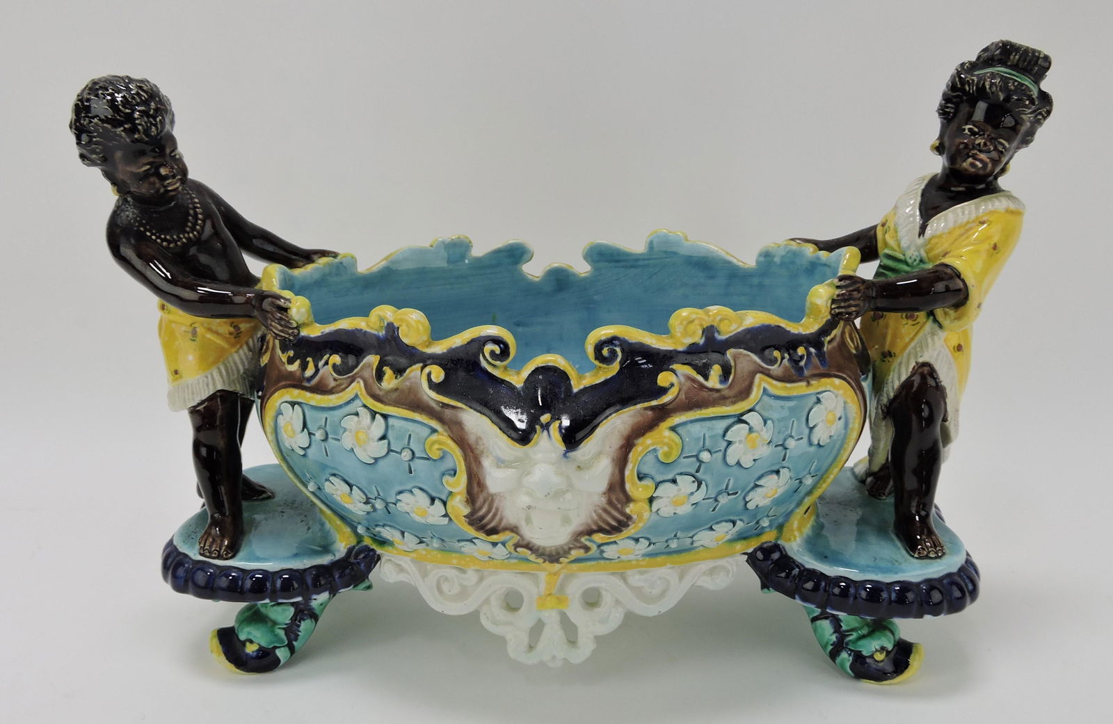 Hugo Lonitz majolica center bowl: supported by Blackamoor man and woman, 8"h, 11"w
