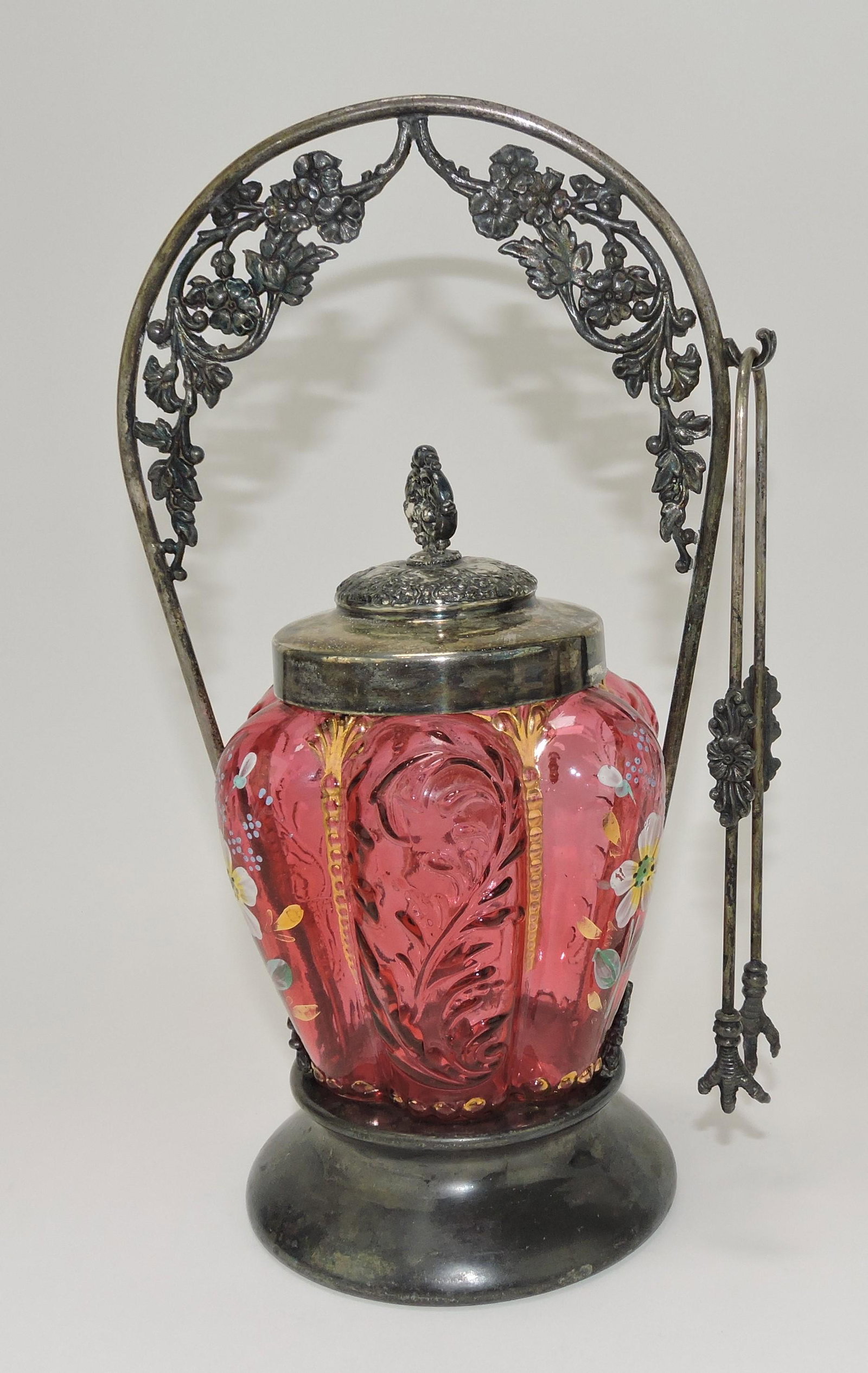 Cranberry paneled pickle castor with: white dogwood blossoms and gold