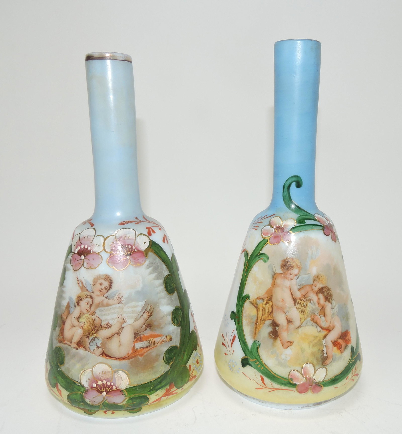 Milk glass hand painted pair of: barber bottles with cherubs