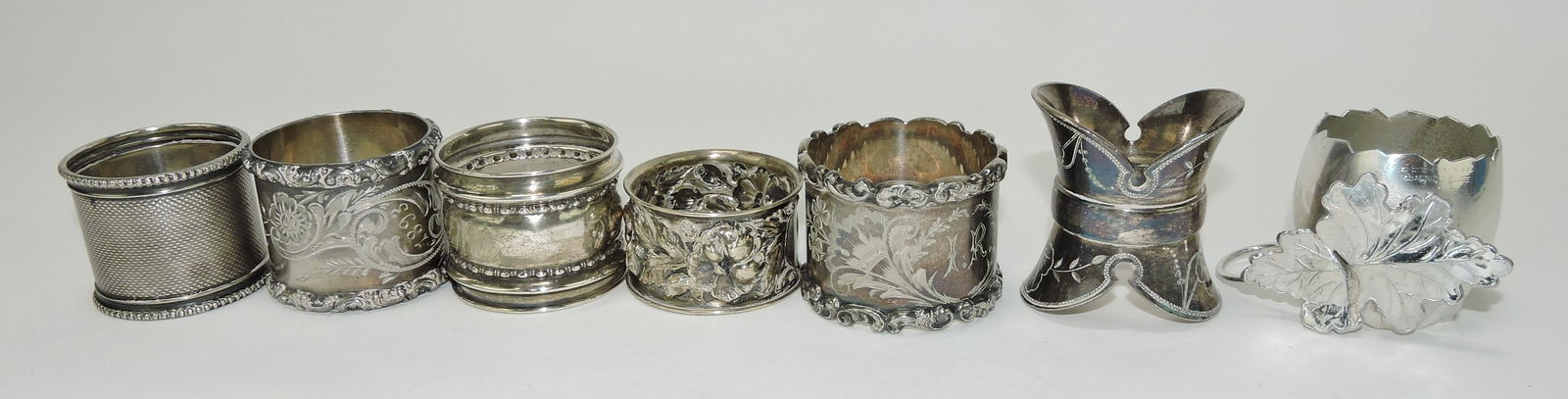 Sterling silver and silverplate lot of: 7 napkin rings