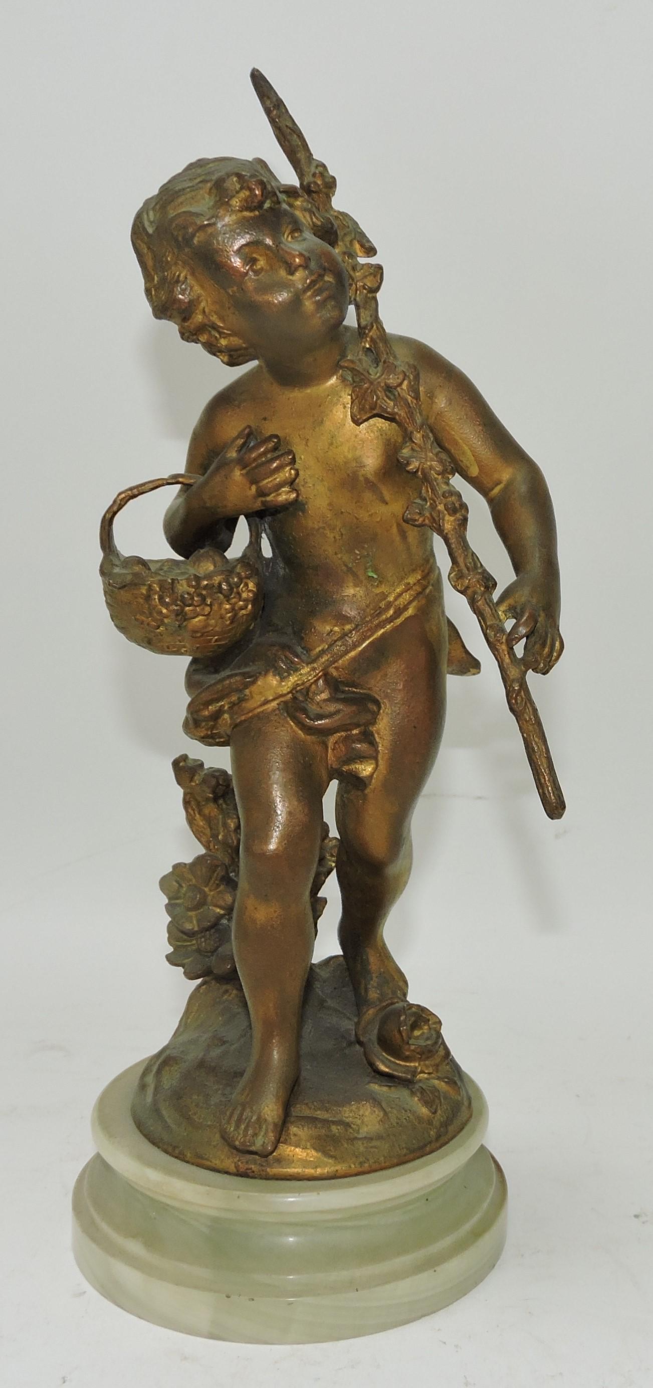 Gilted statue of boy with basket and (1 of 1)