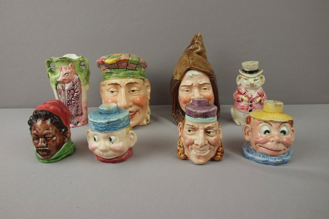 Continental majolica lot of 8 pieces - 2 humidors,: Continental majolica lot of 8 pieces - 2 humidors, 2 banks, vase, and 3 face bottles, various condition