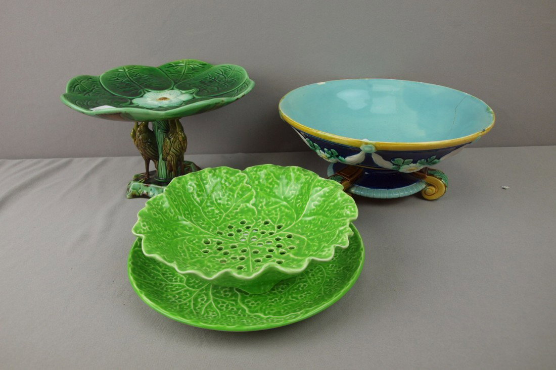 Majolica lot of 3 items - cobalt footed bowl (hair: Majolica lot of 3 items - cobalt footed bowl (hairline), stork pond lily comport (professional rim repair) and Minton light green pierced leaf bowl and stand,
