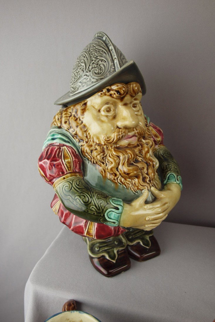 SARREGUEMINES rare figural toby jug with helmet l: SARREGUEMINES rare figural toby jug with helmet lid, professional repair to rim of helmet and sword handle, no. 1197, 12"