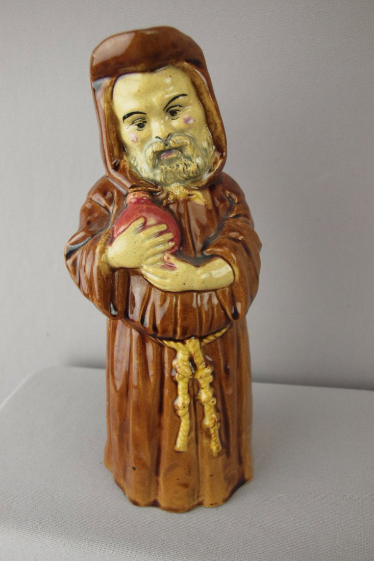 St. Clement French figural jug in the form of a m: St. Clement French figural jug in the form of a monk clutching a bottle, 10", ref: Cunningham p. 99