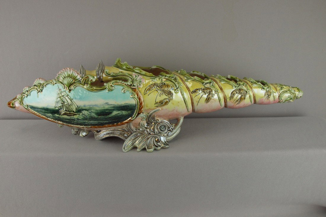 Wilhelm Schiller & Son (WS&S) large shell table c: Wilhelm Schiller & Son (WS&S) large shell table center caviar server in the form of a long shell supported by two mythological fish, painted panel of ship on the ocean, lobsters and fish in high relie