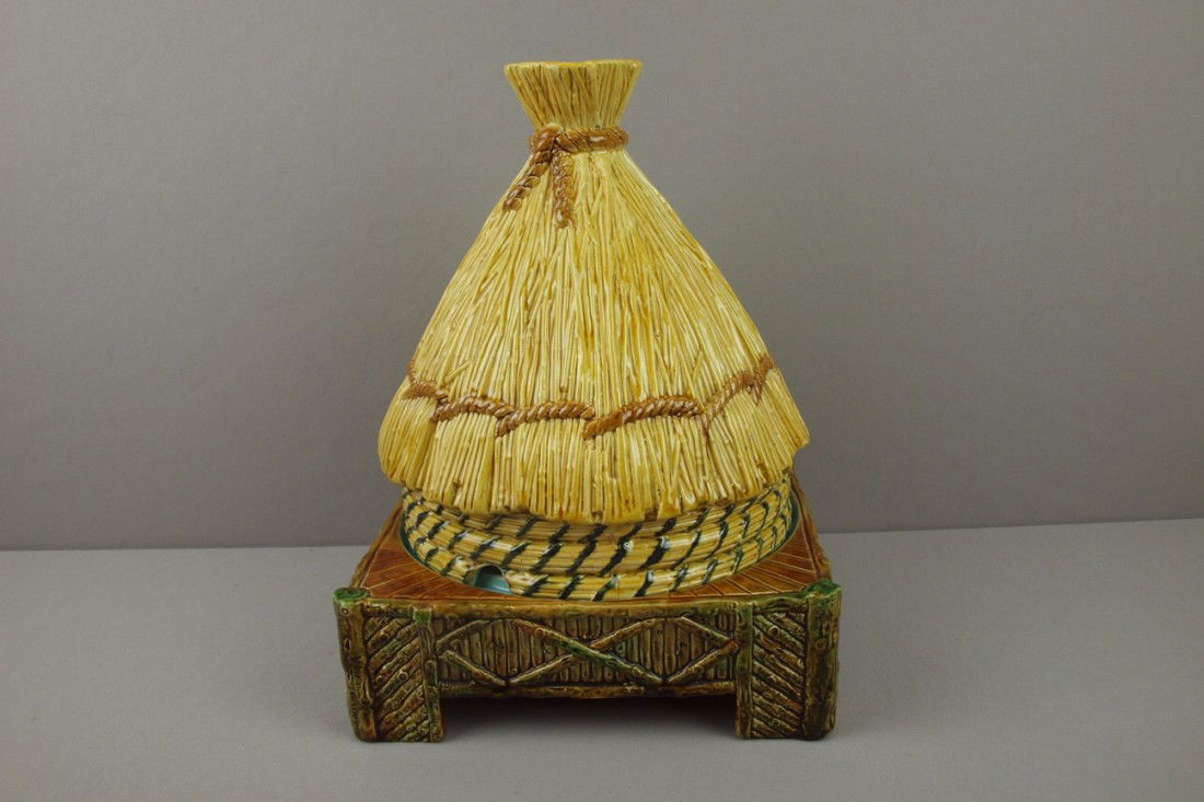 GEORGE JONES majolica thatched hut cheese keeper: GEORGE JONES majolica thatched hut cheese keeper with yellow top, great color and detail, minor rim chip to interior rim of base, minor nick to base rim of cover, professional rim chip repair to top o