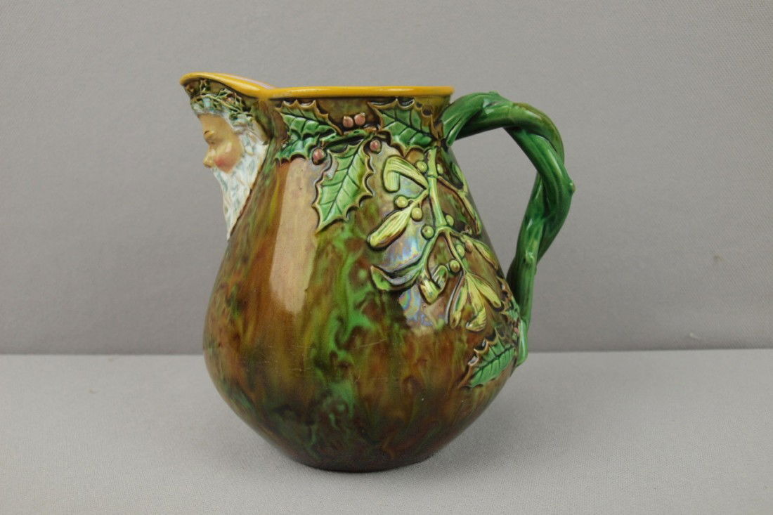 GEORGE JONES mottled majolica "Father Christmas": GEORGE JONES mottled majolica "Father Christmas" jug with vine handle, 5 1/2"