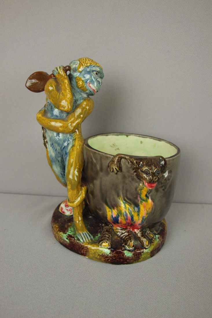 Thomas Sergent figural of monkey with large spoon: Thomas Sergent figural of monkey with large spoon and kettle over a fire cooking stew with animal crawling out over top, 8", signed TS and MINTON Ltd, professional repair to spoon