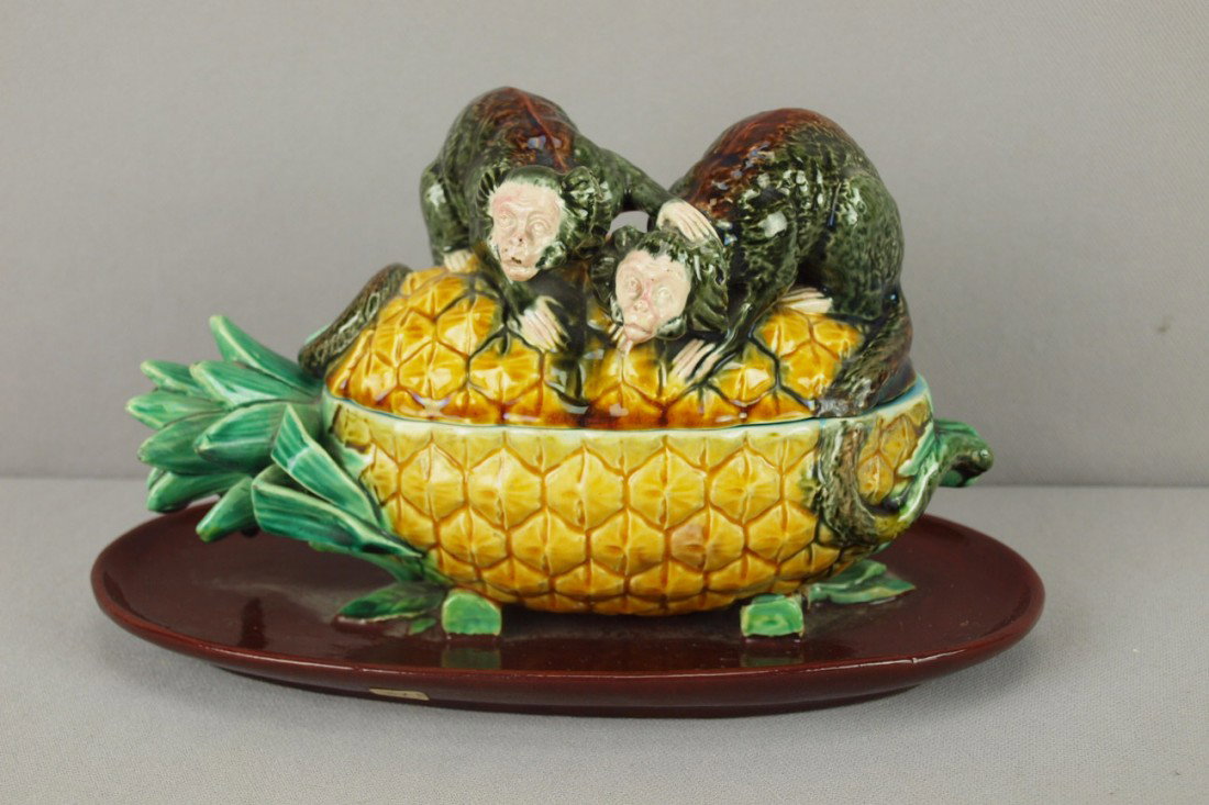 MINTON rare majolica inkwell desk stand in the fo: MINTON rare majolica inkwell desk stand in the form of two monkeys atop a pineapple, includes original inkwell inserts, professional rim repair to tray, shape no. 1703 , 9 1/2"l, 6"h, very rare form