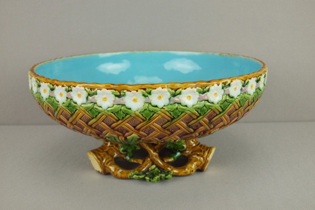 MINTON majolica table center of wicker bowl with : MINTON majolica table center of wicker bowl with daisy border and branch feet, 12"d, 5 1/2"h, shape no. 1921, professional repair to leaf on base