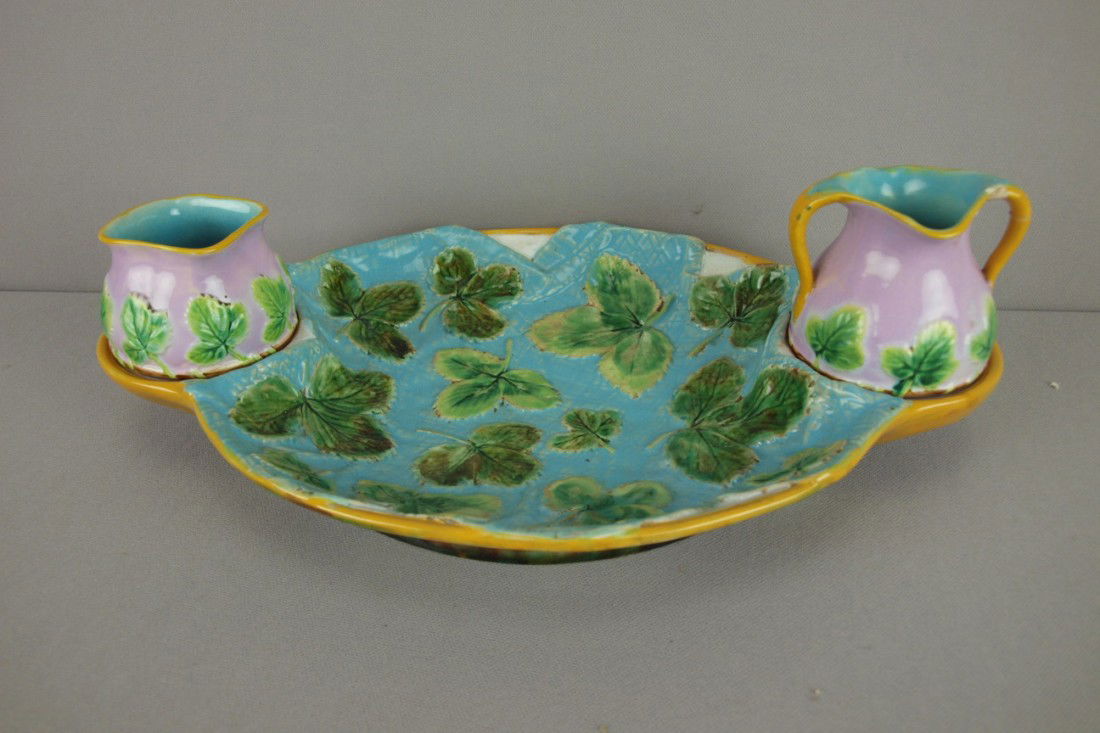 GEORGE JONES majolica napkin strawberry server wi: GEORGE JONES majolica napkin strawberry server with turquoise napkin and pink cream and sugar, creamer has chip and broken handle, 14"l