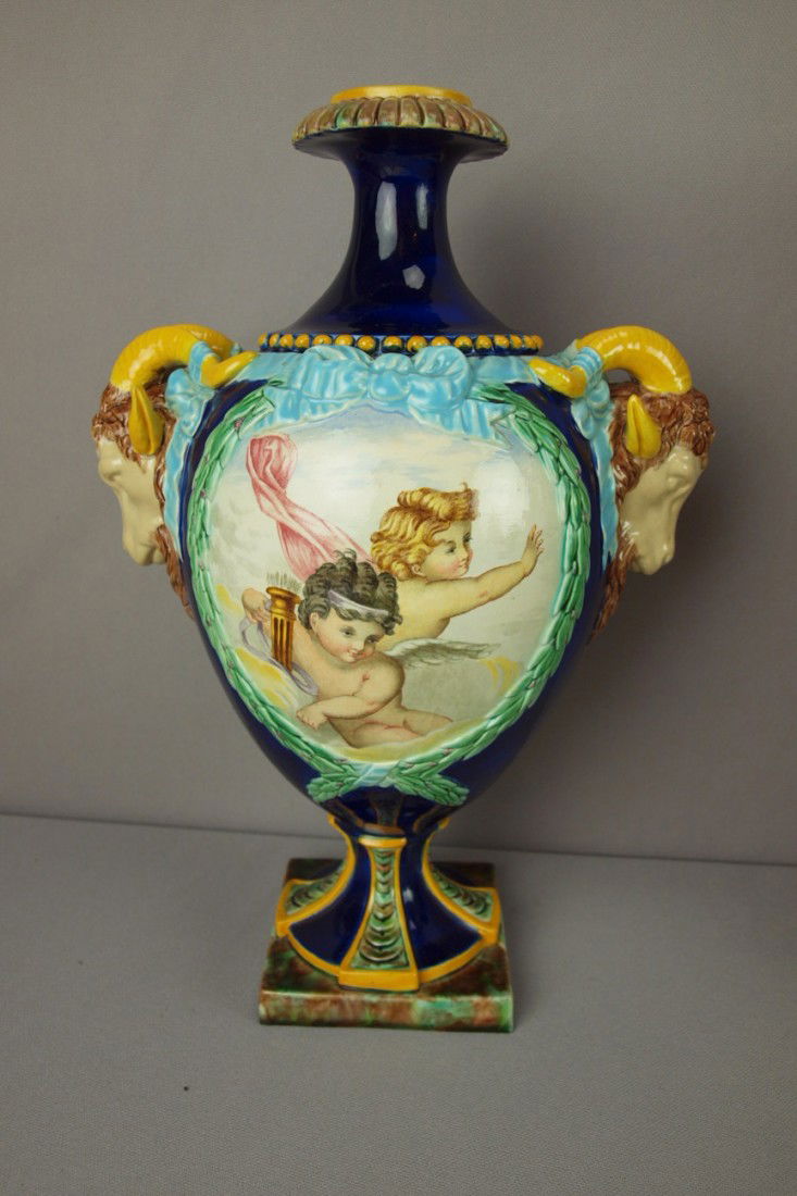 GEORGE JONES cobalt vase with ram's head handles: GEORGE JONES cobalt vase with ram's head handles and painted panel with angels on one side and doves with basket of flowers on the other, 13", professional repair to ram's ears