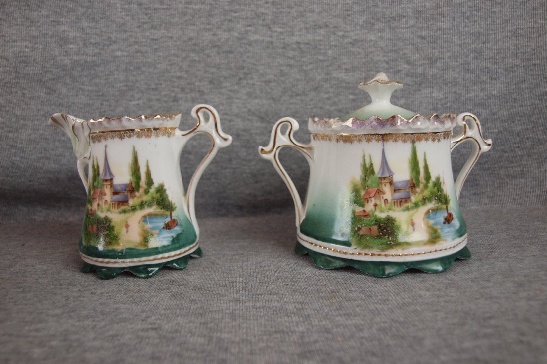 R.S. Prussia cream and sugar with castle scene, rim