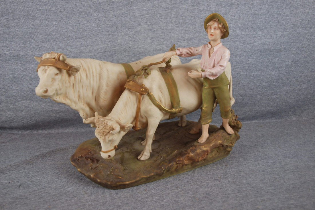 Royal Dux figure of man with pair of oxen, 10 3/4"