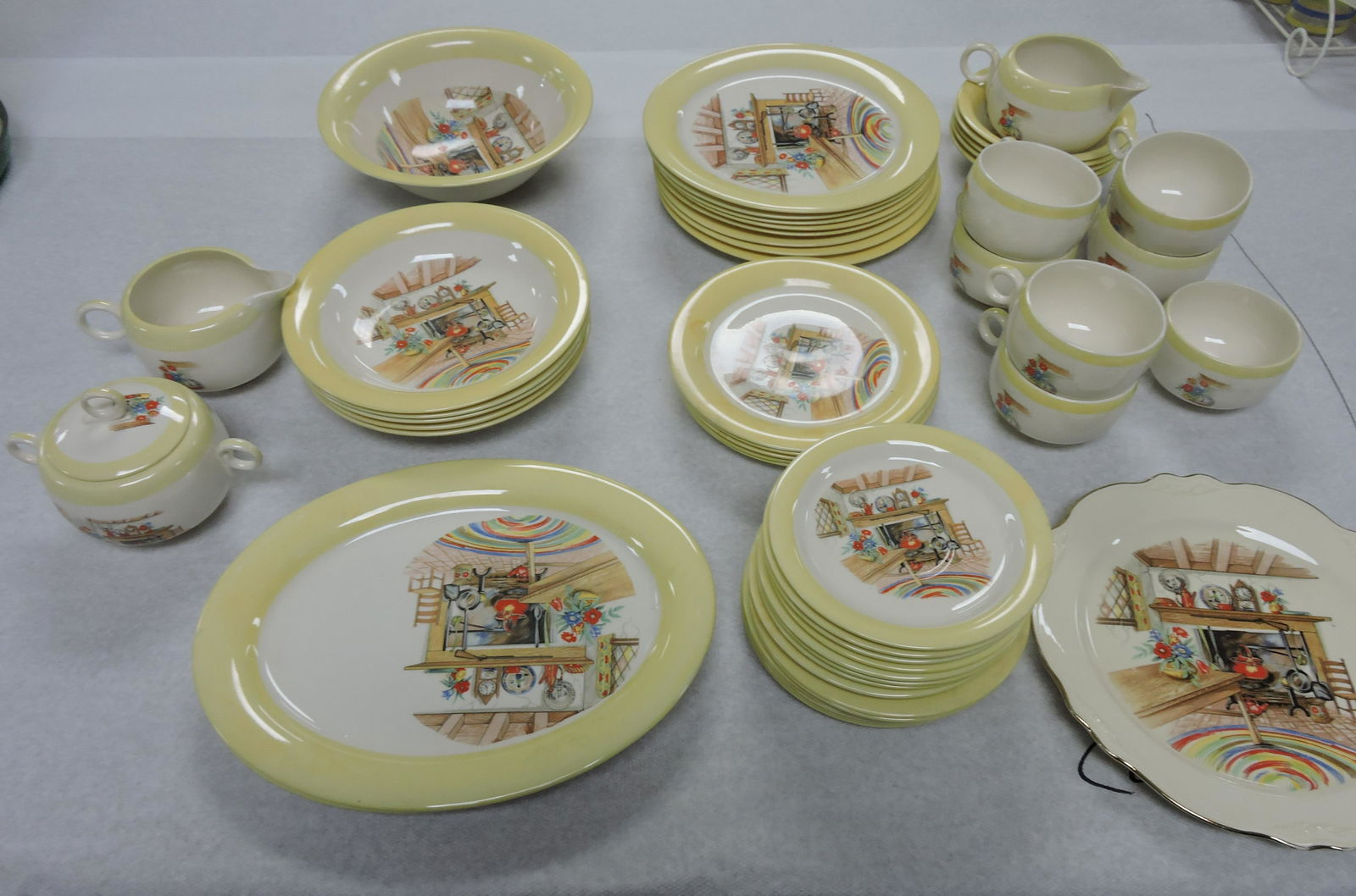 Homer Laughlin Colonial Kitchen lot: of 51 pieces: 2 - 11 1/4" platters, 5 - 8" soup bowls, 8 1/2" serving bowl, 8 - 9 1/4", 5 - 7", & 6 - 6" plates, 5 fruit bowls, 2 creamers, sugar, 7 cups, 8 saucers, 9 1/4" plate; various condition