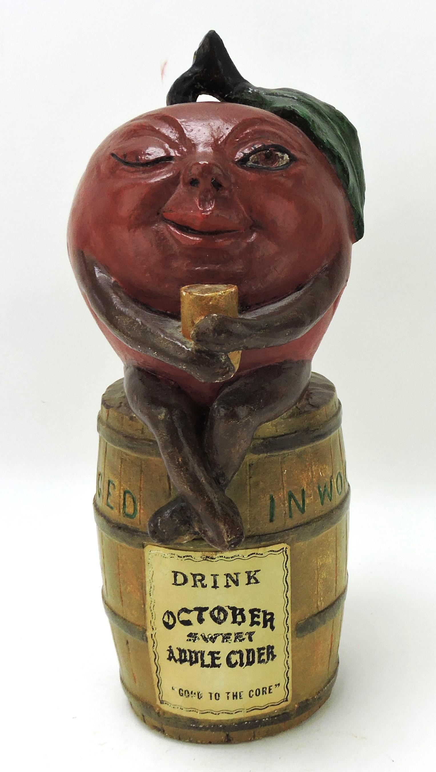 Chalkware figural apple on barrel (1 of 2)