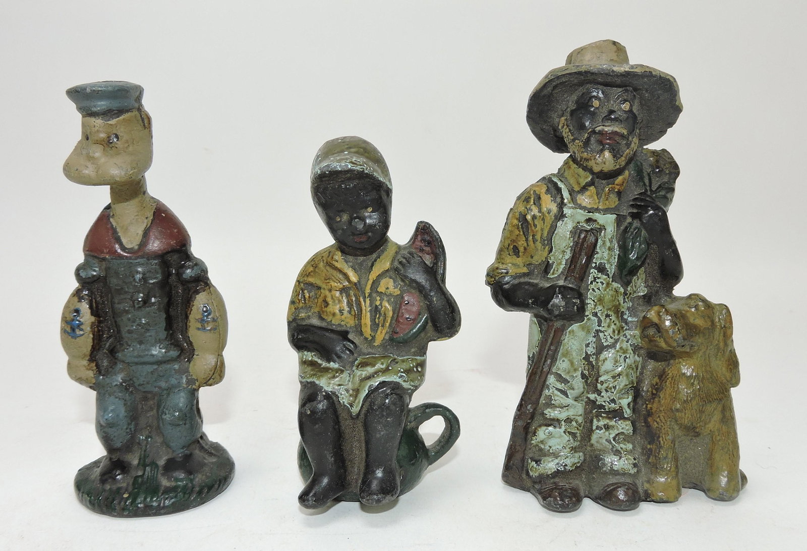 Lot of 3 lead figures: Popeye, Black: American boy on pot, Black American man with shotgun and dog, 4 to 5"; Flower Family Collection
