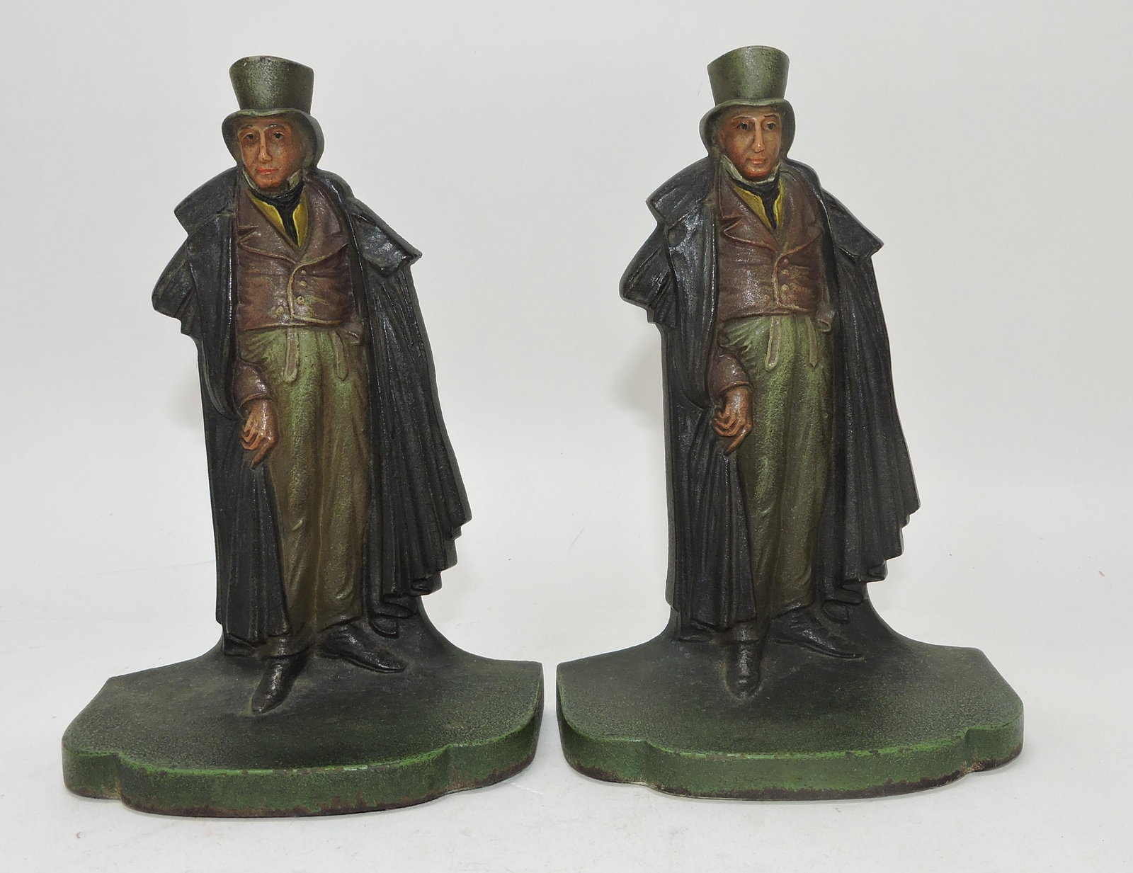 Bradley & Hubbard cast iron pair of: bookends of gentleman with top hat, 6 1/4"; Flower Family Collection