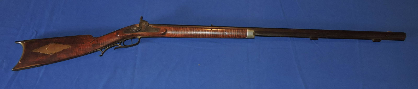 Half stock percussion rifle, 31 caliber,: tiger maple half stock with brass and silver, 35 1/2" barrel, 51 1/2" overall