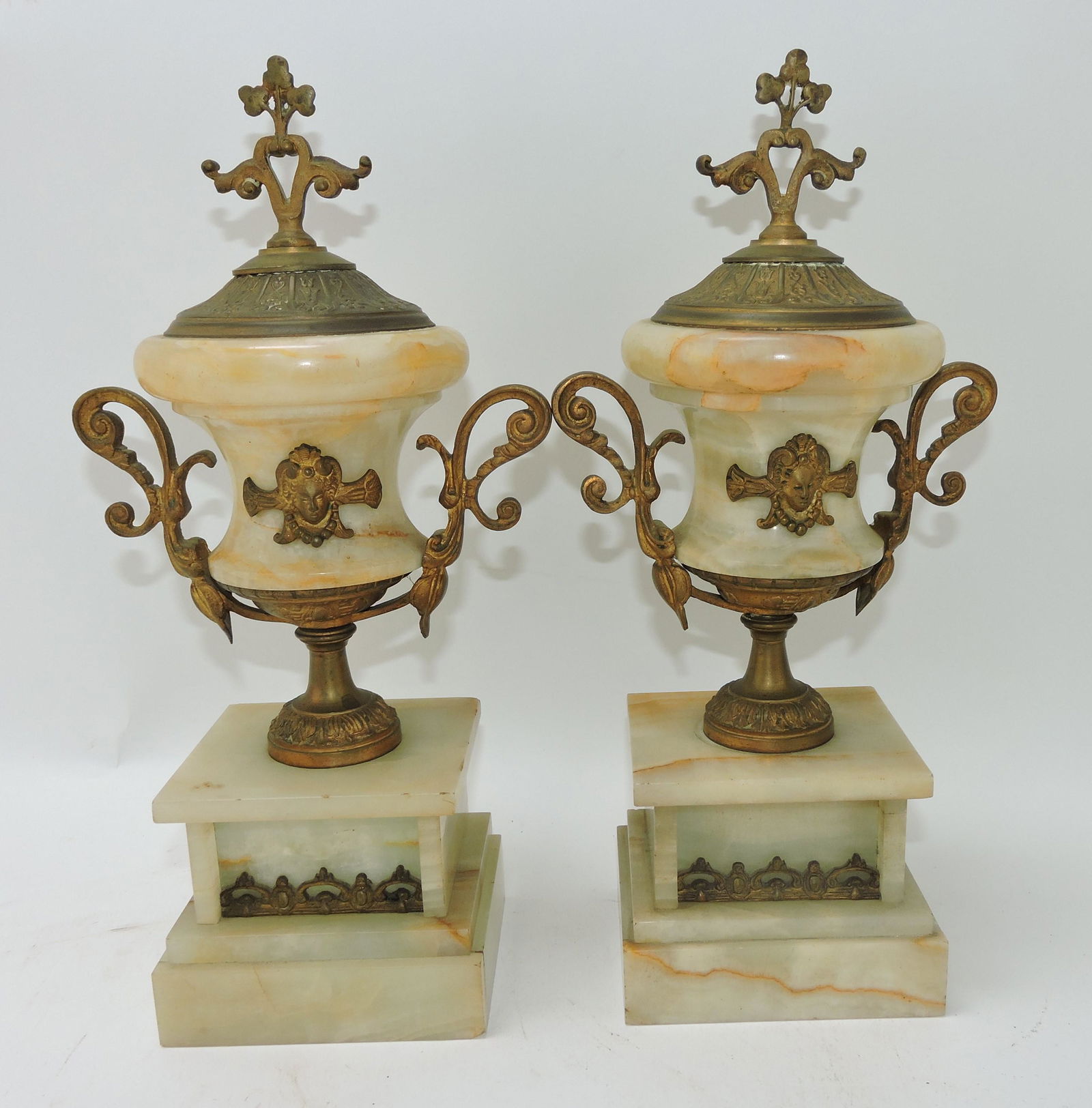 Pair of onyx and brass garnitures, 13": .