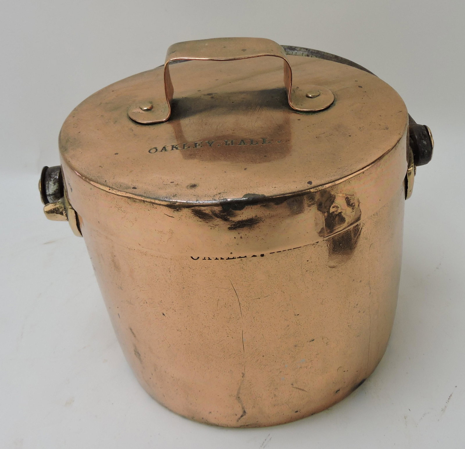 Copper covered bucket with iron: bail handle marked Oakley Hall