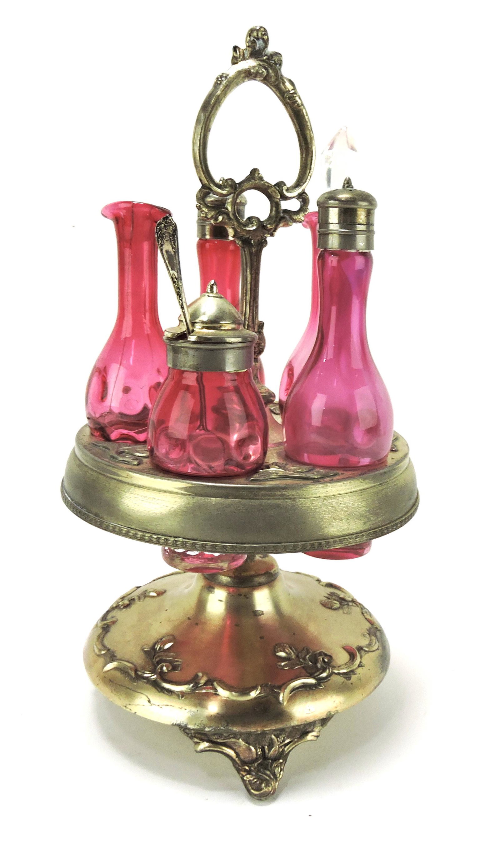 Castor bottle set with cranberry bottles,: one cracked
