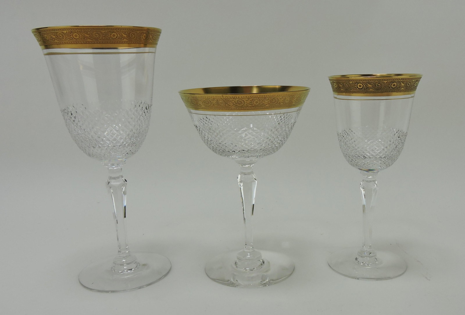 La Scala by Hawkes set of gold: gilted stemware, 3 - 7 1/2" water goblets, 7 - 5 3/4" champagne, 6 - 6" wine