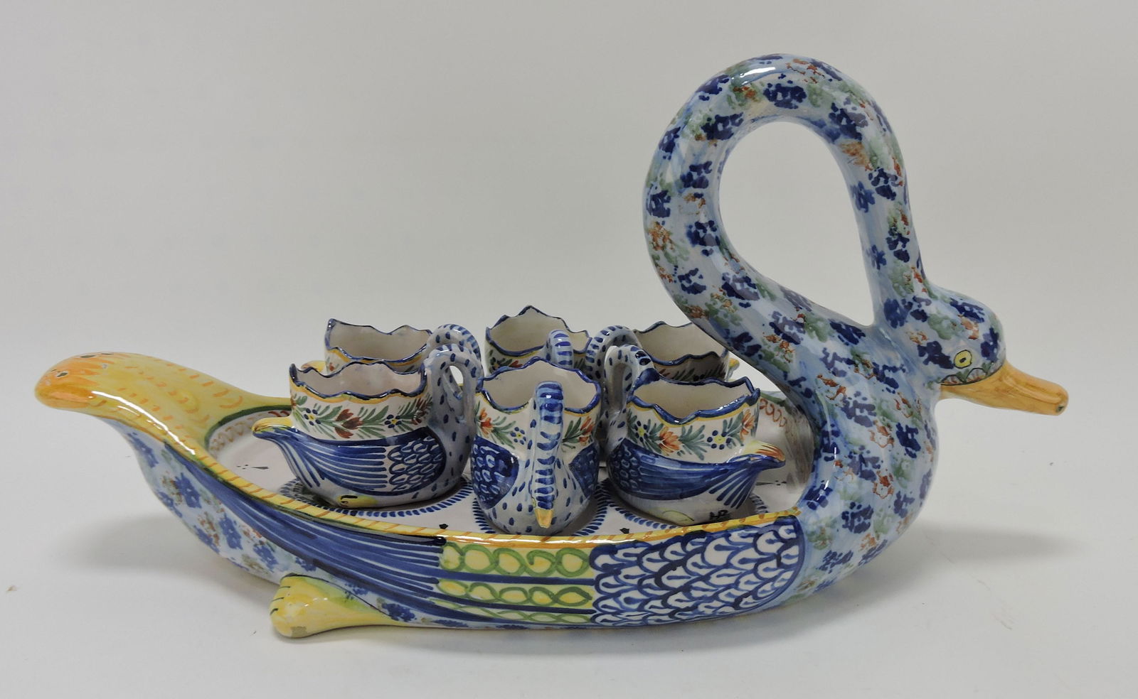 Quimper Faience swan egg cup holder: and 6 egg cups, 15 1/2"
