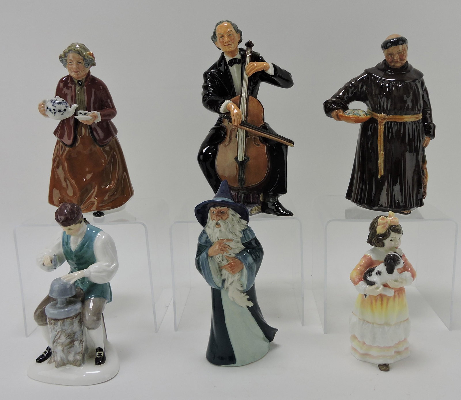 Royal Doulton lot of 6 figures:: Tea Time HN2255, The Cellist HN2226, The Jovial Monk HN2144, The Silversmith of Williamsburg HN2208, Gandalf HN2911 (nick to tip of hat), Faithful Friend HN3696 artist signed